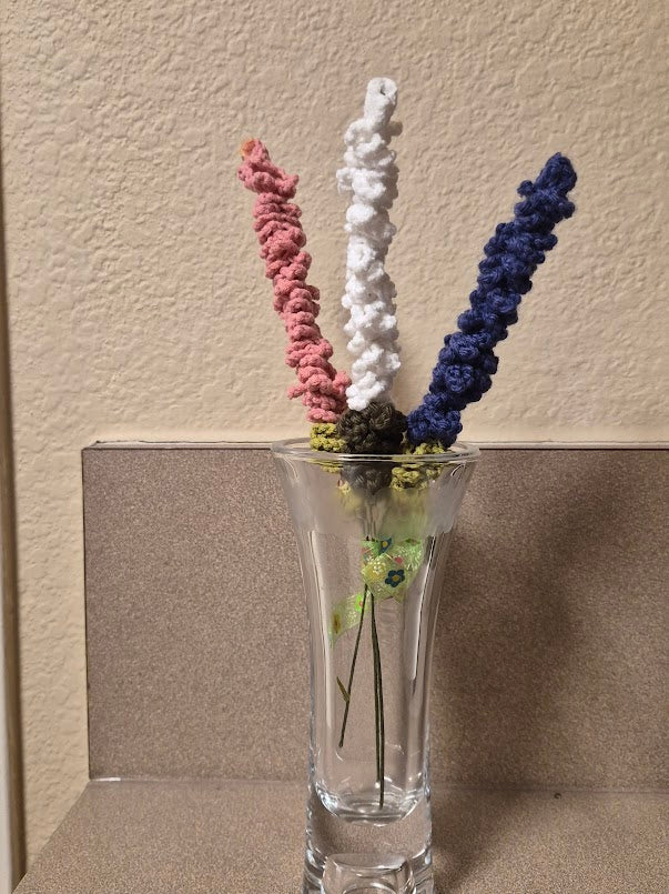 Pink, white and dark purple cotton yarn lavender arrangement shown in a clear vase, vase not included