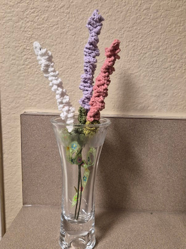 White, lavender and pink cotton yarn lavender arrangement shown in a clear vase, vase not included