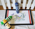 Handmade crochet plush crayons in blue and green/yellow/white with sweet faces, displayed next to a colorful coloring page
