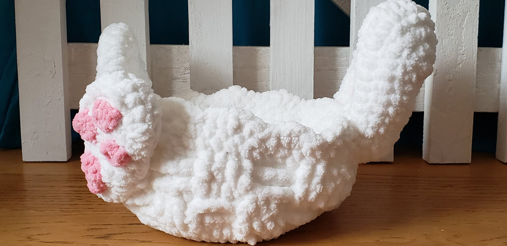 White crochet Easter bunny basket side profile view showing depth and bunny ear height