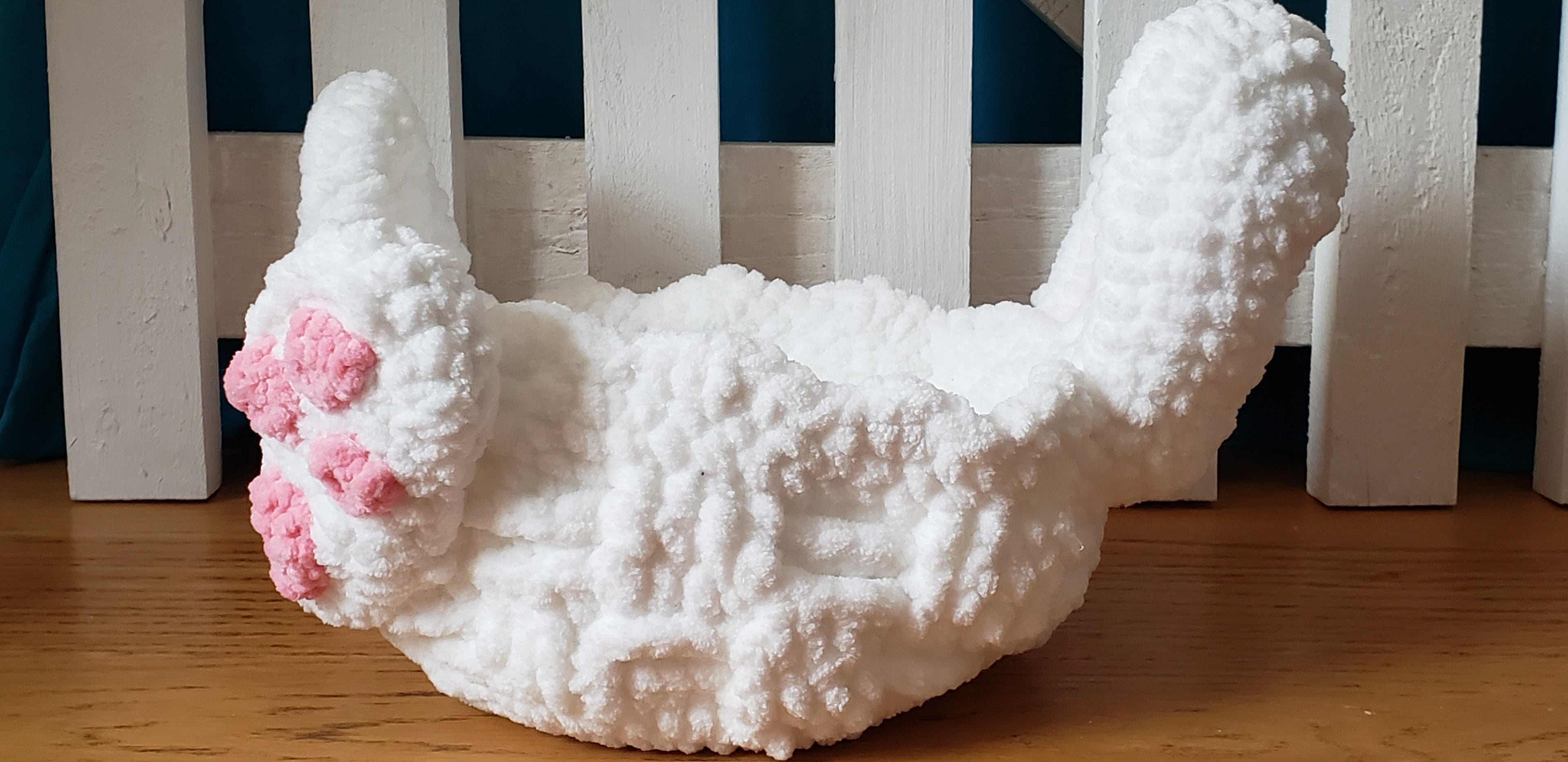 White crochet Easter bunny basket side profile view showing depth and bunny ear height