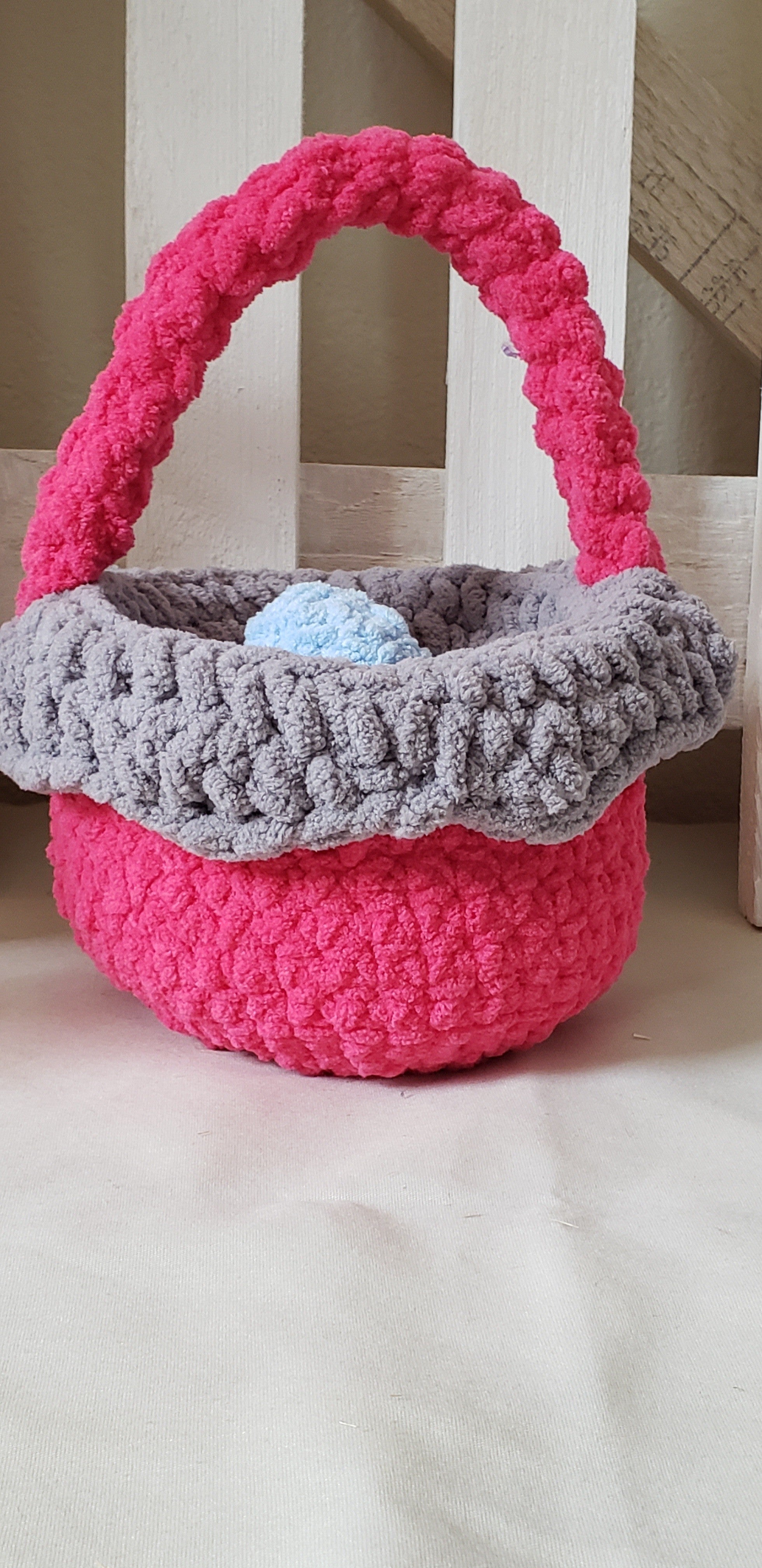 Hot pink crochet Easter basket side view showing basket shape and handle